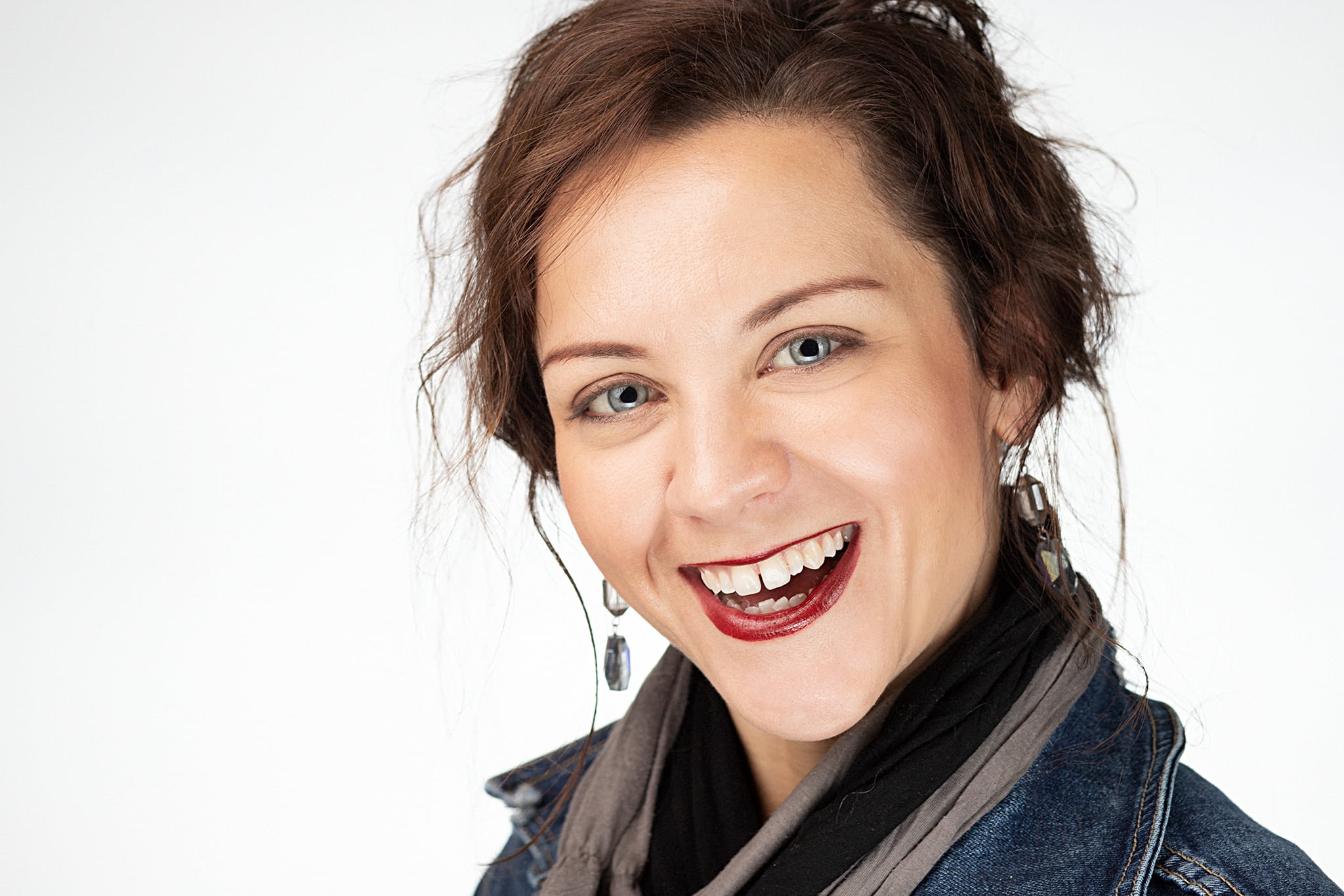 Business portrait of a blue eyed woman with a big smile